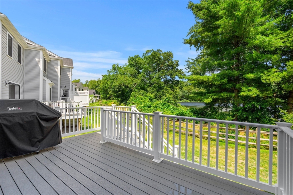 32 Cutter Lane, Unit 32 Amesbury, MA 01913 - Photo 37 of 37 a balcony with wooden floor and fence