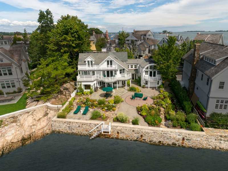 an aerial view of a house with a yard basket ball court and outdoor seating