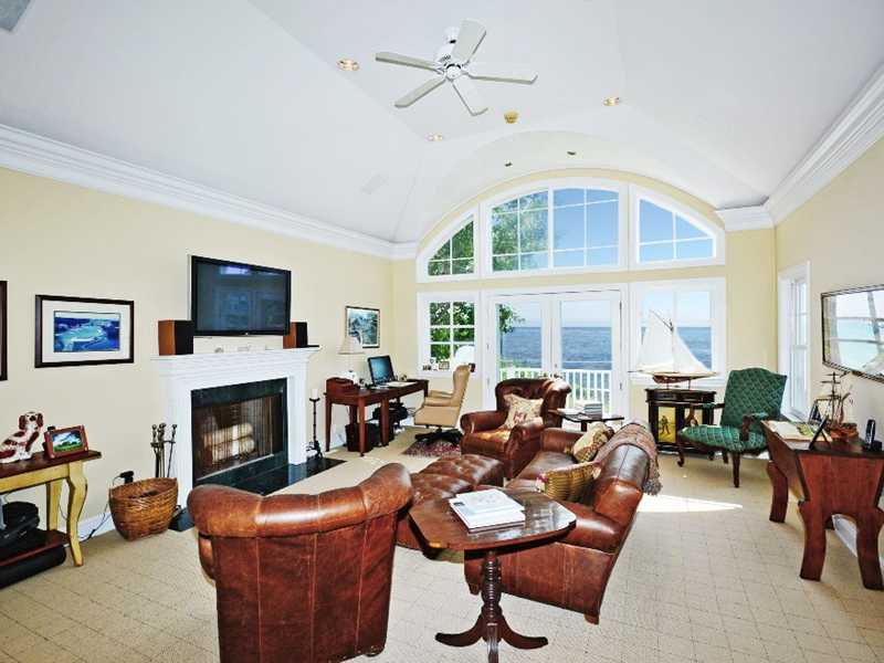 16 Rocky Point Road Rowayton, CT 06853 - Photo 13 of 25 a living room with furniture a fireplace and a flat screen tv