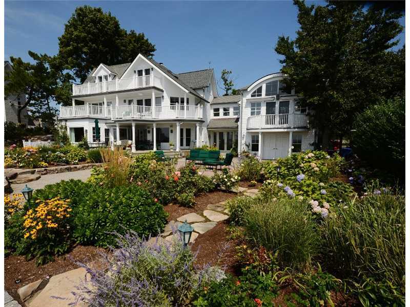 16 Rocky Point Road Rowayton, CT 06853 - Photo 2 of 25 a front view of a house with a yard and fountain