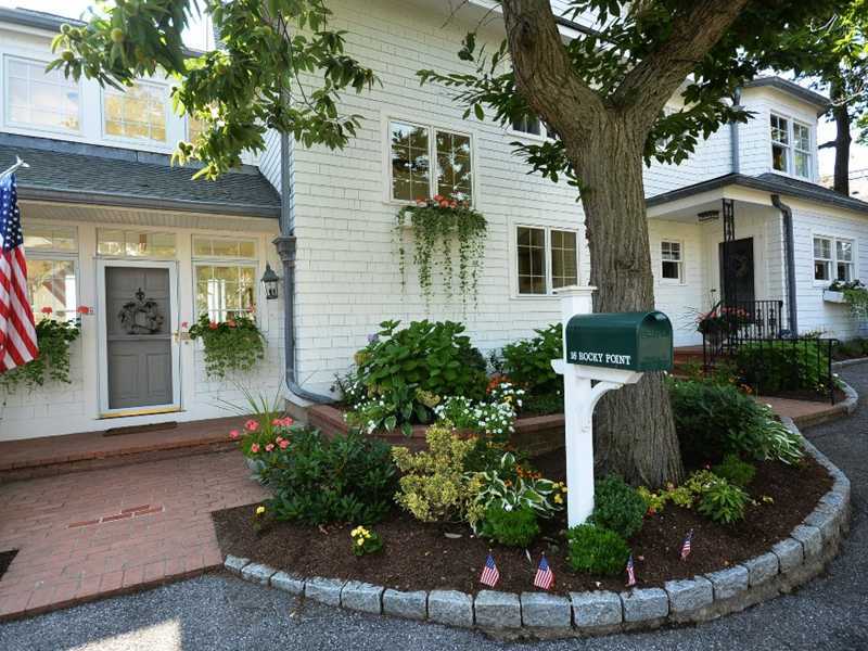 16 Rocky Point Road Rowayton, CT 06853 - Photo 24 of 25 a front view of a house with garden