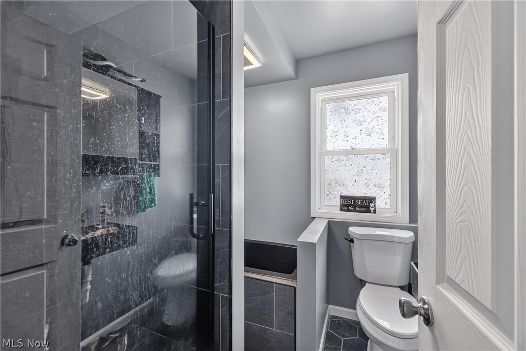 1128 Irene Road Lyndhurst, OH 44124 - Photo 19 of 25 First floor full bath. Has a soaking tub and walk in shower