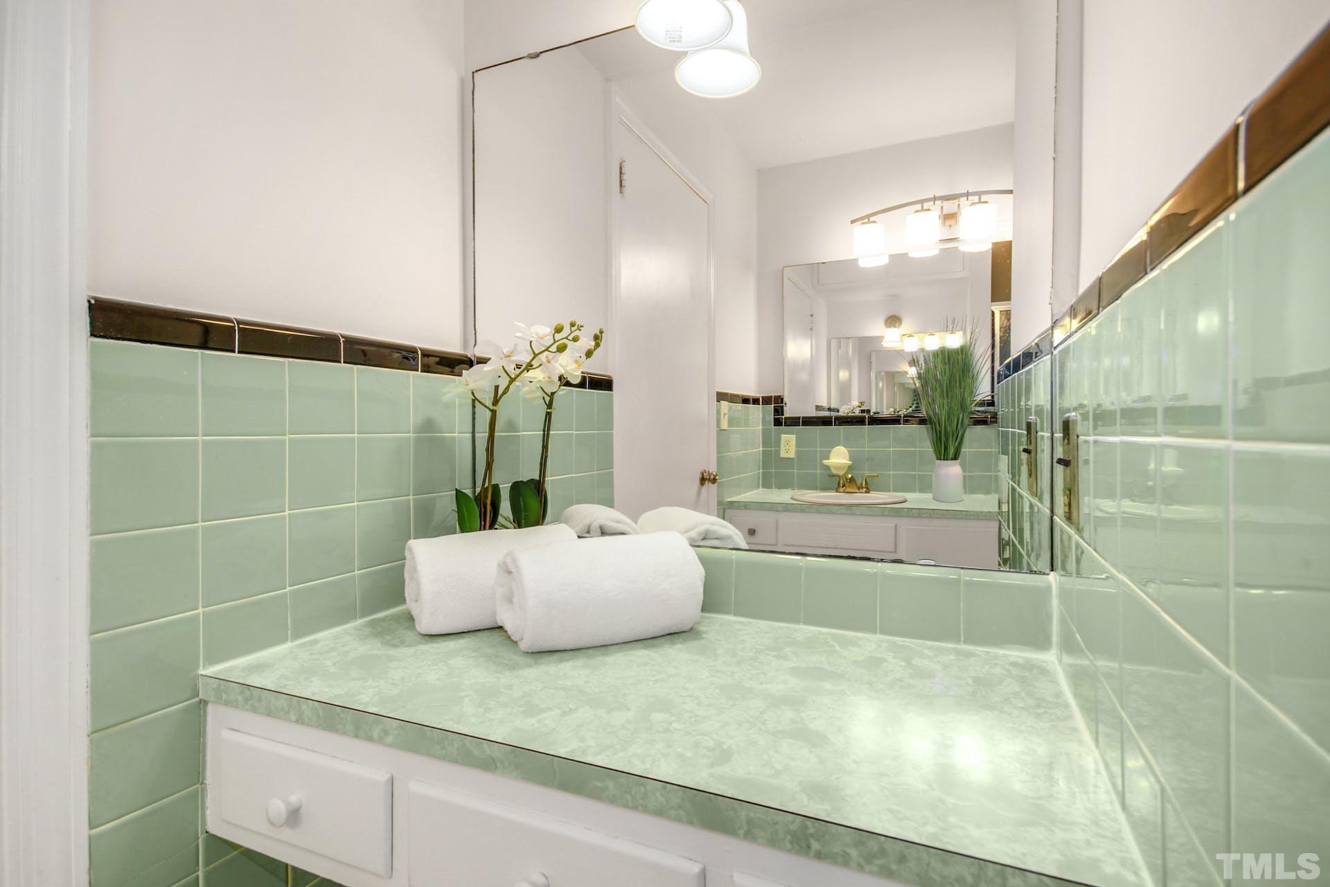 2805 Haven Road Raleigh, NC 27610 - Photo 23 of 29 a bathroom with a granite countertop sink a toilet and a shower