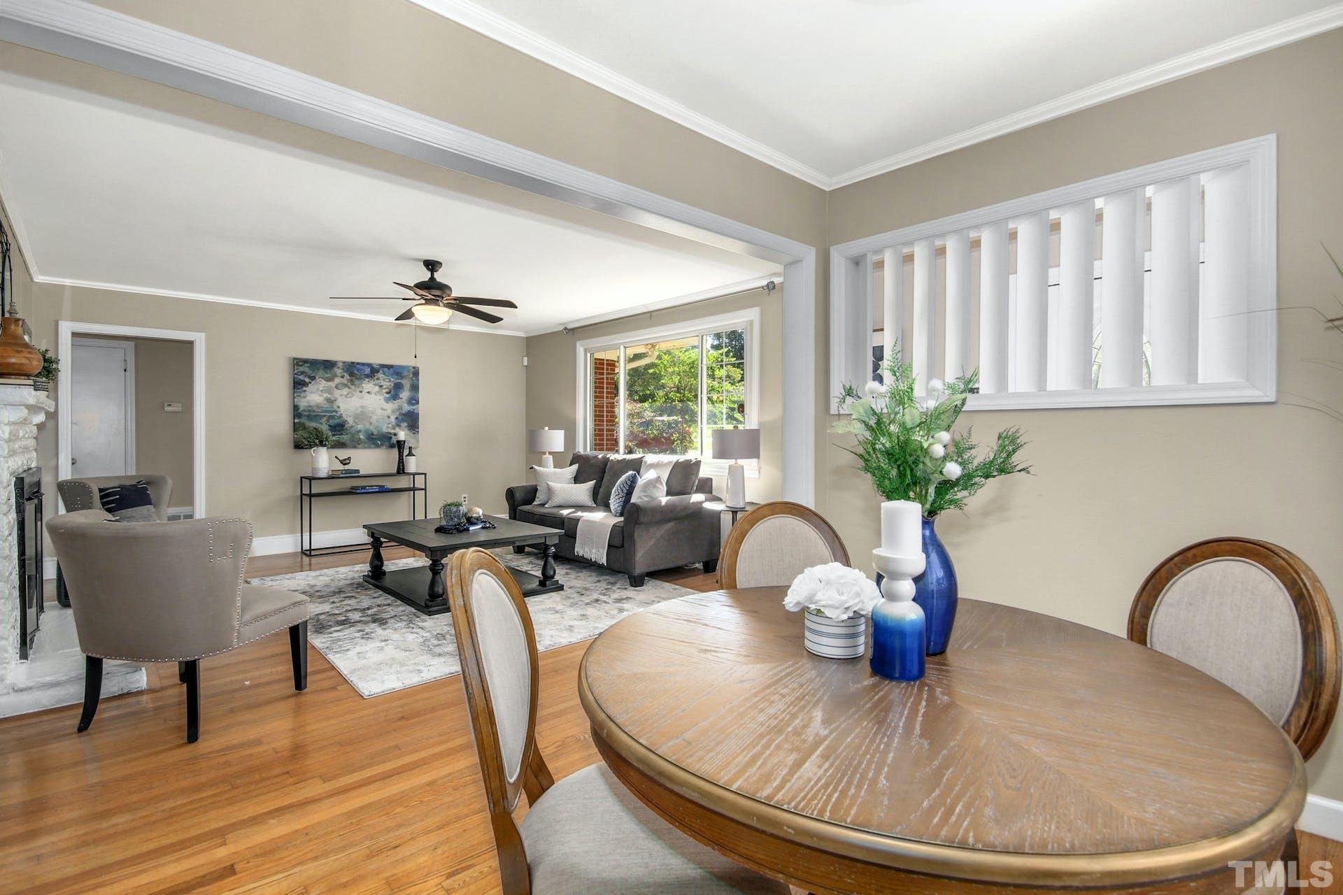 2805 Haven Road Raleigh, NC 27610 - Photo 6 of 29 a dining room with furniture potted plants and wooden floor
