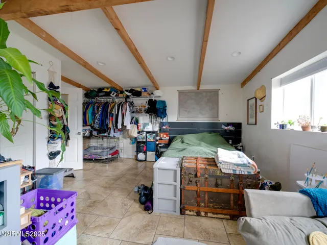 a bed room with a bed and a couch