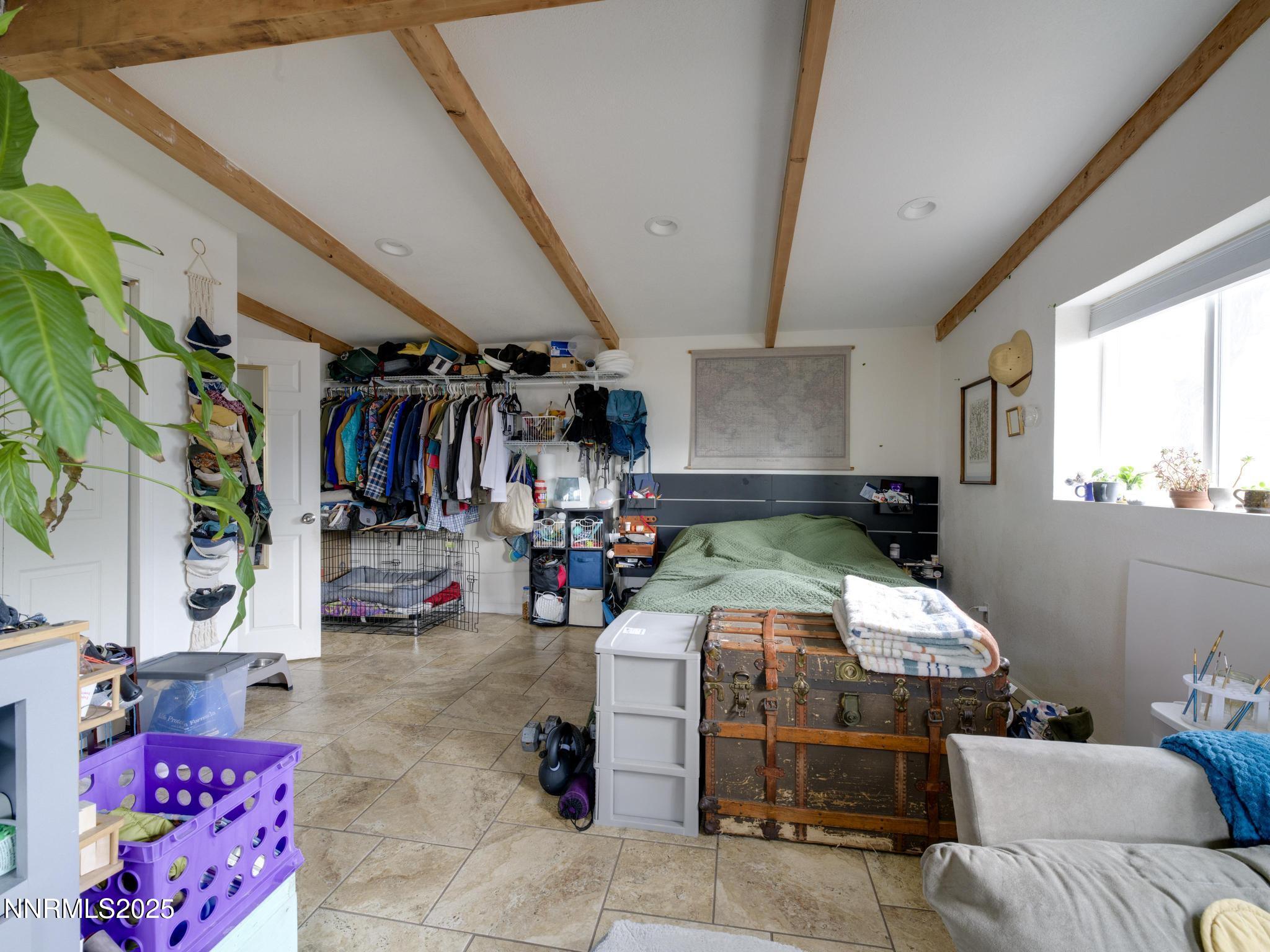 1840 Windsor Way Reno, NV 89503 - Photo 13 of 21 a bed room with a bed and a couch