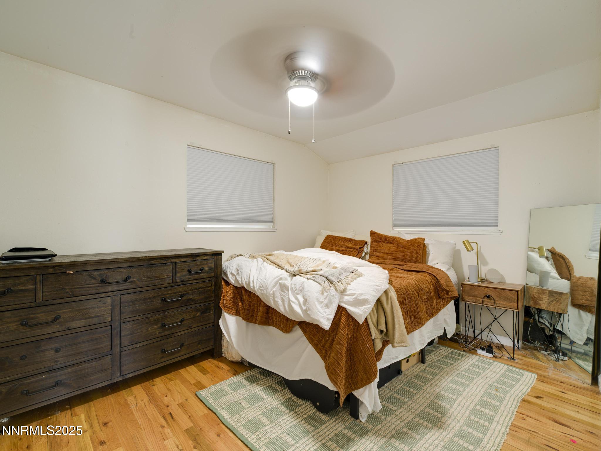 1840 Windsor Way Reno, NV 89503 - Photo 16 of 21 a bedroom with a bed and lamp with dresser