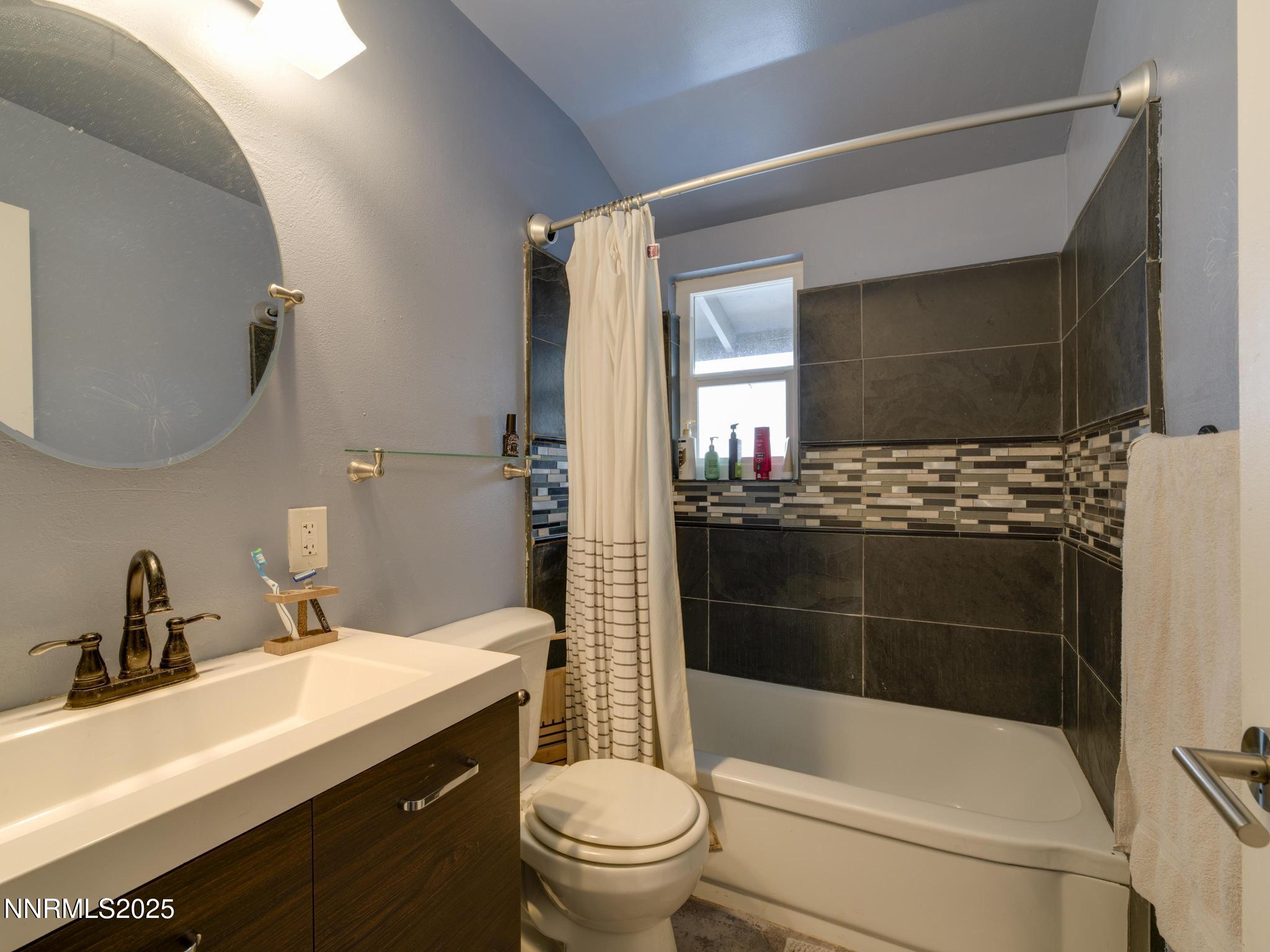 1840 Windsor Way Reno, NV 89503 - Photo 20 of 21 a bathroom with a sink a toilet and shower