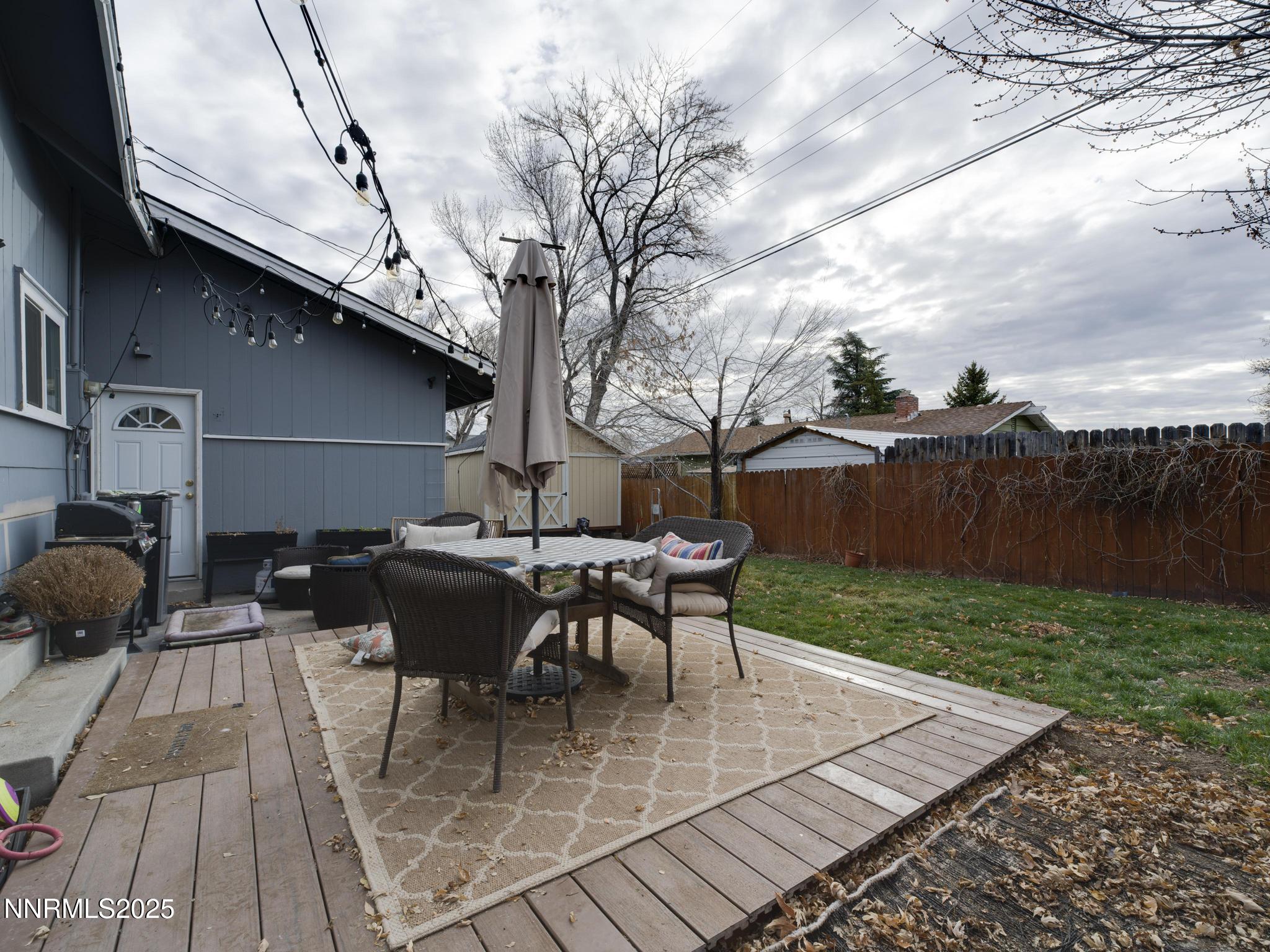 1840 Windsor Way Reno, NV 89503 - Photo 3 of 21 a view of backyard with table and chairs couches with wooden fence and plants