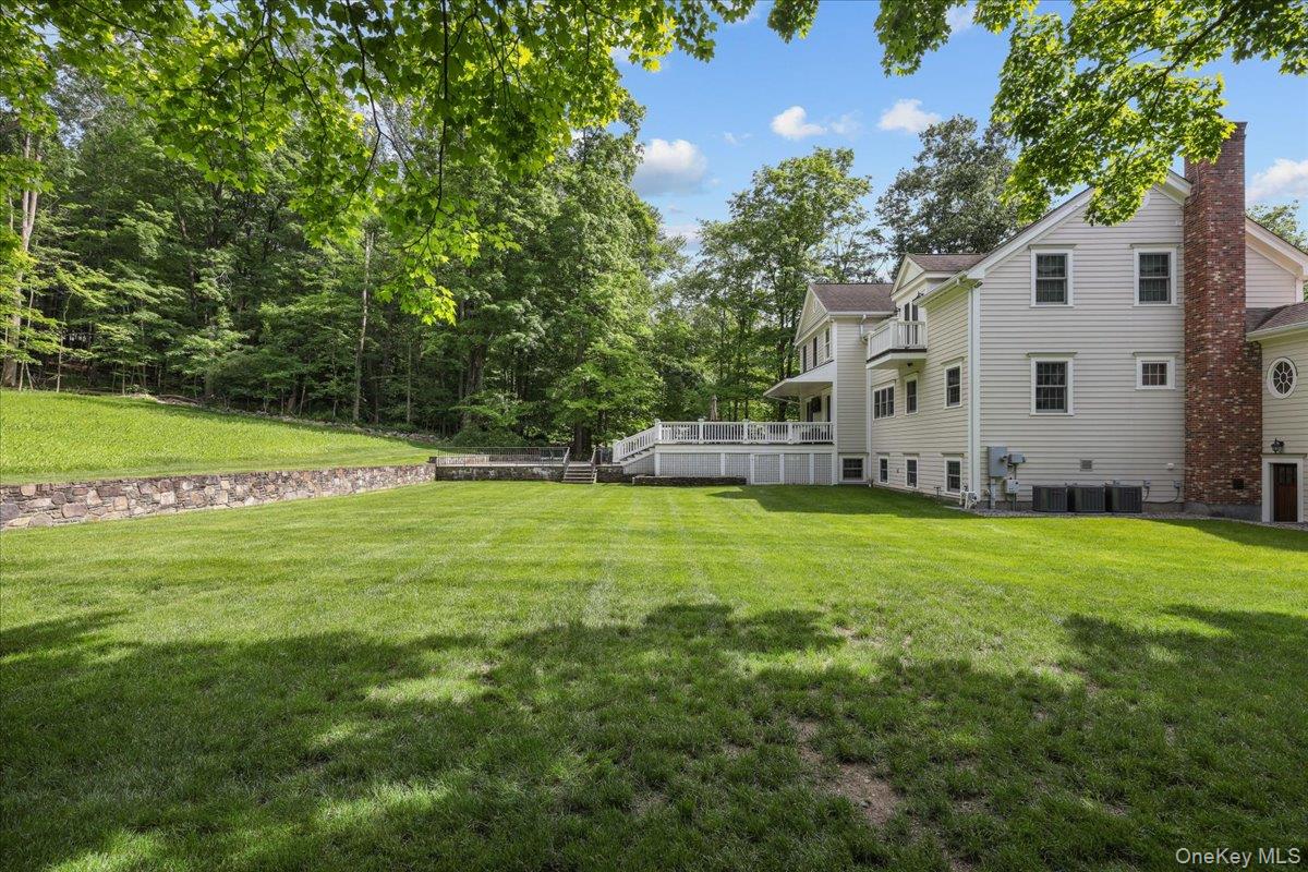 135 Pines Bridge Road Katonah, NY 10536 - Photo 35 of 40 a view of a house with a backyard