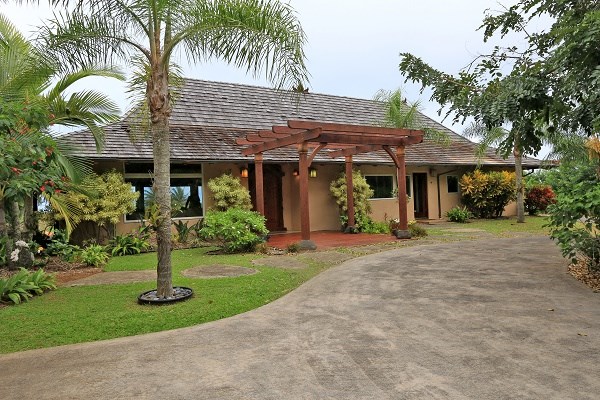 560 North Holokai Road Haiku, HI 96708 - Photo 1 of 30 a front view of a house with garden
