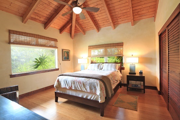 560 North Holokai Road Haiku, HI 96708 - Photo 18 of 30 a bedroom with a bed and window