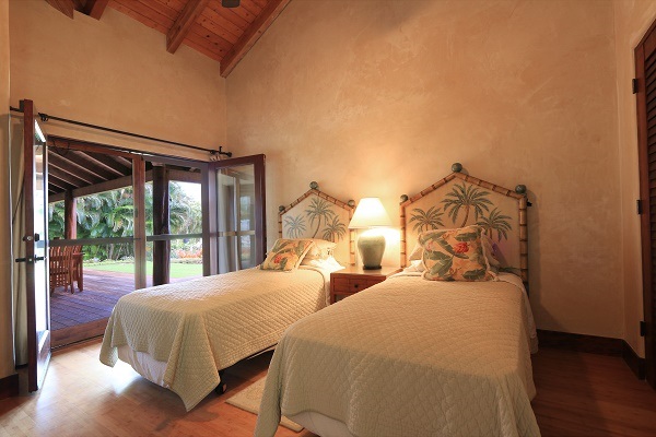 560 North Holokai Road Haiku, HI 96708 - Photo 19 of 30 a bedroom with two beds and a large window