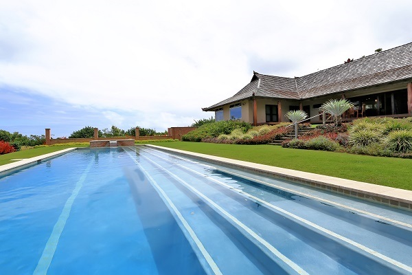 560 North Holokai Road Haiku, HI 96708 - Photo 2 of 30 a view of house with yard and ocean view