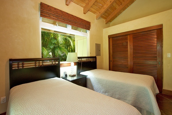 560 North Holokai Road Haiku, HI 96708 - Photo 30 of 30 a bedroom with two beds and a large window