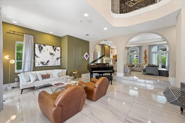 a living room with furniture a rug and a flat screen tv