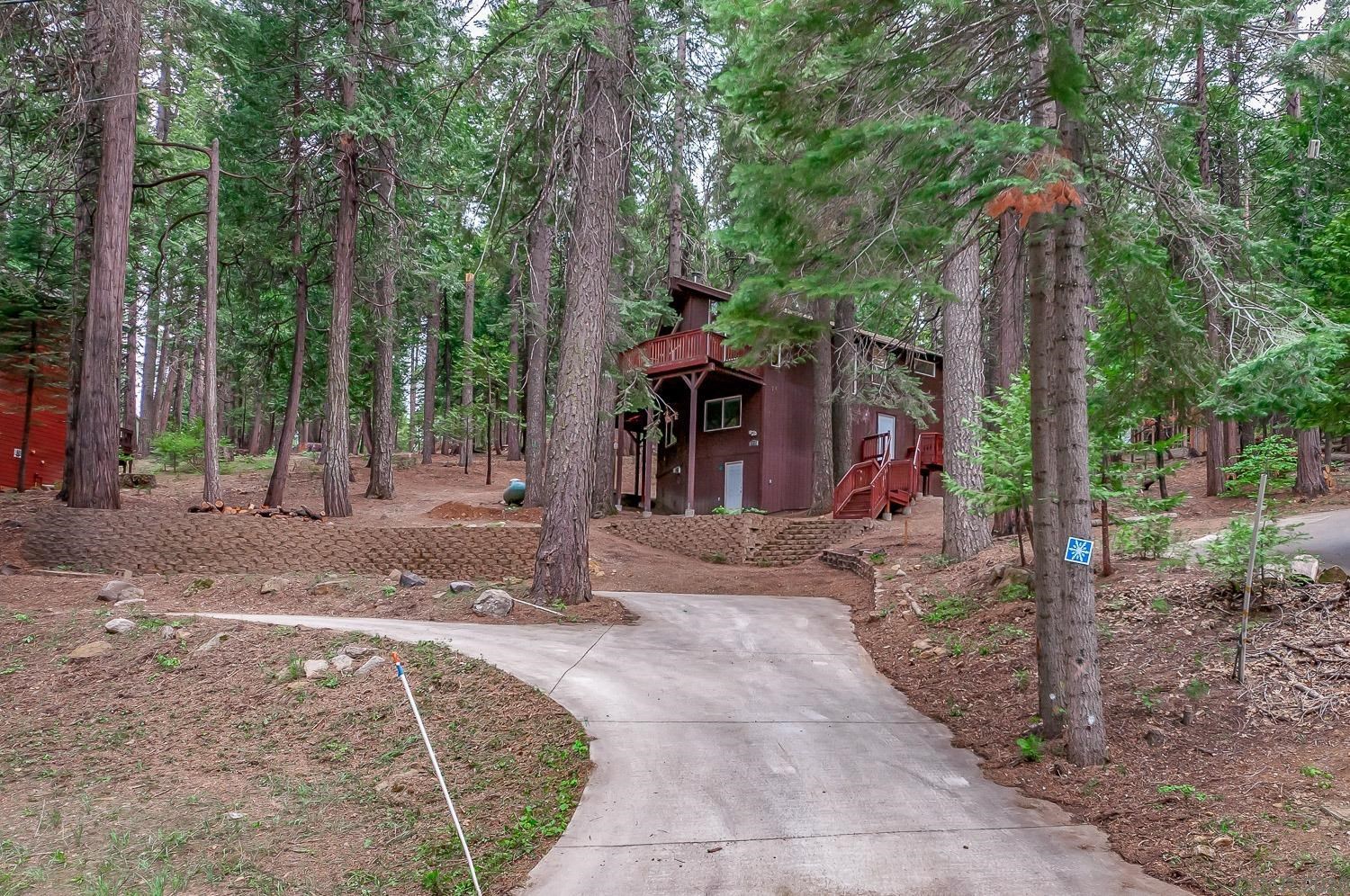 2223 Karock Road Dorrington, CA 95223 - Photo 1 of 1 a view of a park that has large trees and a wooden fence