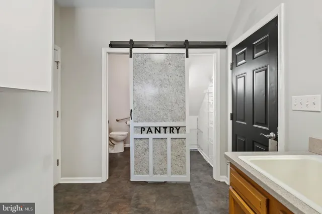 a bathroom with a tub and a sink