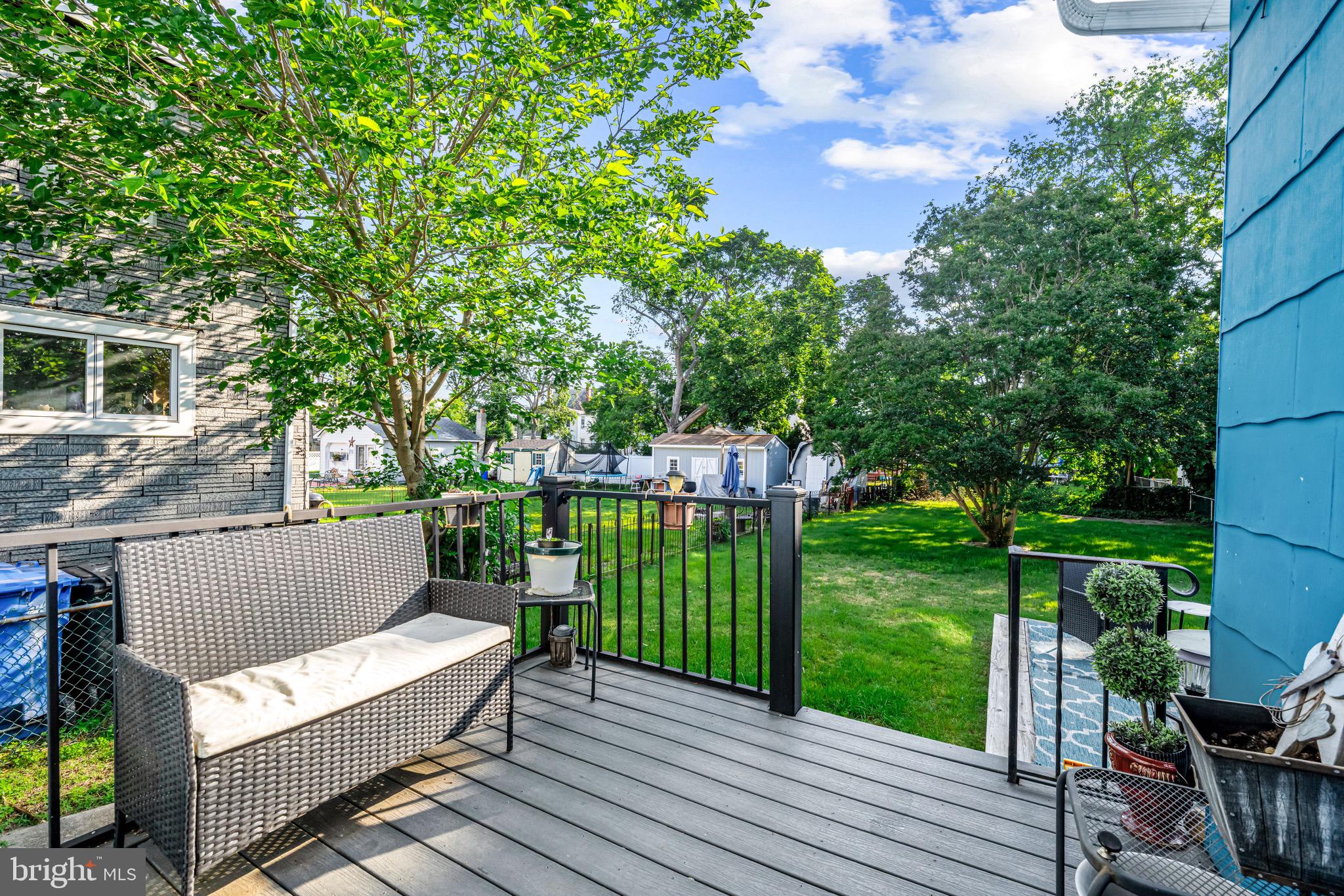 127 Cleveland Avenue Riverside, NJ 08075 - Photo 23 of 23 a view of a deck with a bench and floor to ceiling window