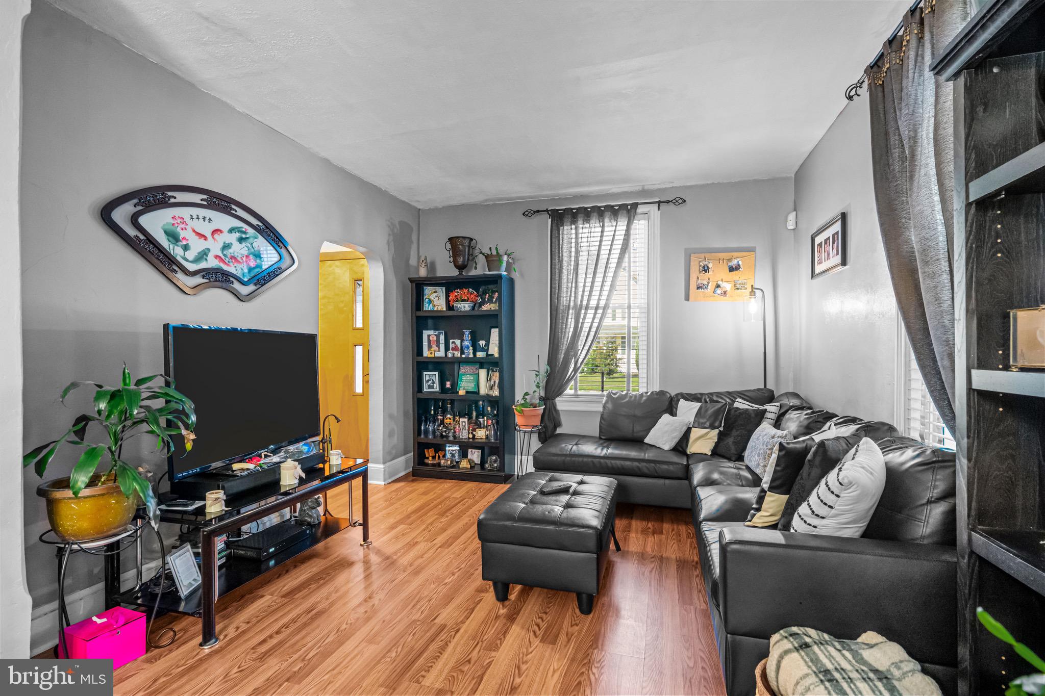 127 Cleveland Avenue Riverside, NJ 08075 - Photo 5 of 23 a living room with furniture flat screen tv and a window