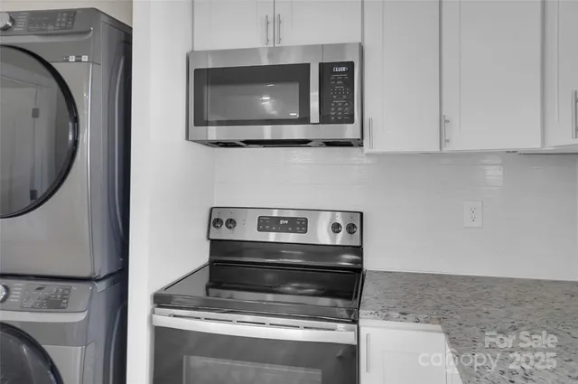 a kitchen with a stove and a microwave