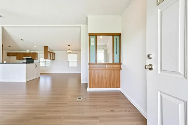 a view of a kitchen cabinets and wooden floor