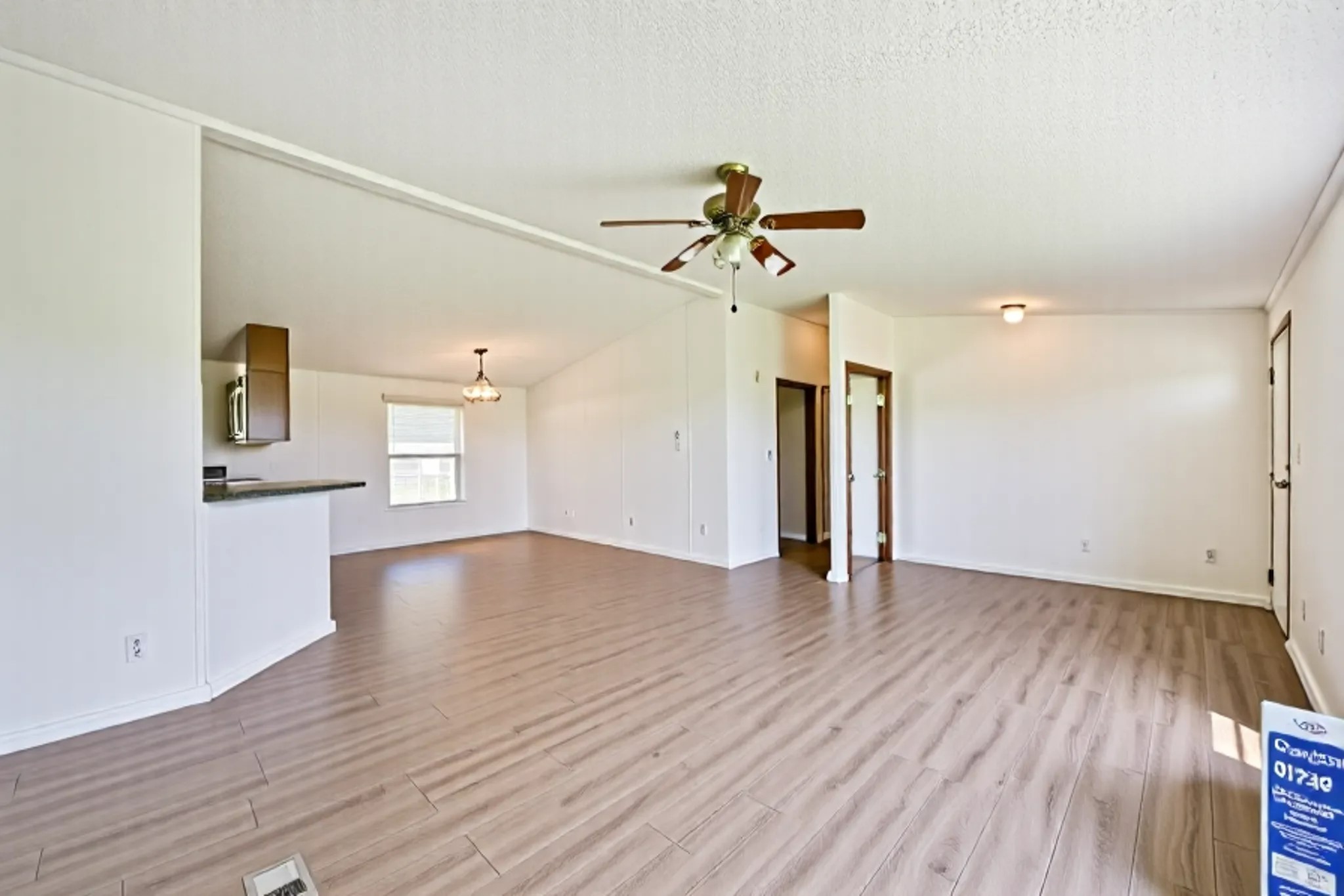 14515 Farm To Market Road 523 Angleton, TX 77515 - Photo 15 of 25 a view of empty room with wooden floor and ceiling fan