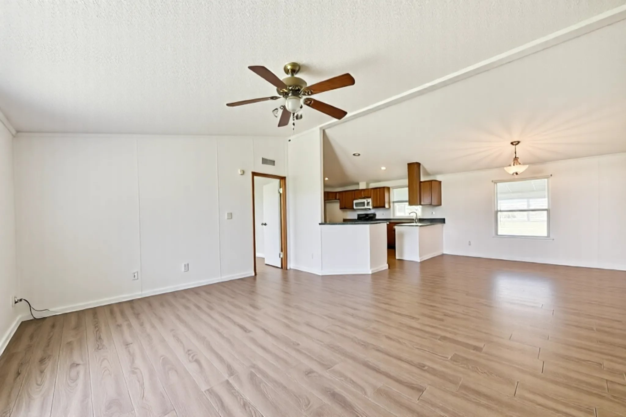 14515 Farm To Market Road 523 Angleton, TX 77515 - Photo 16 of 25 a view of a kitchen with a sink and wooden floor