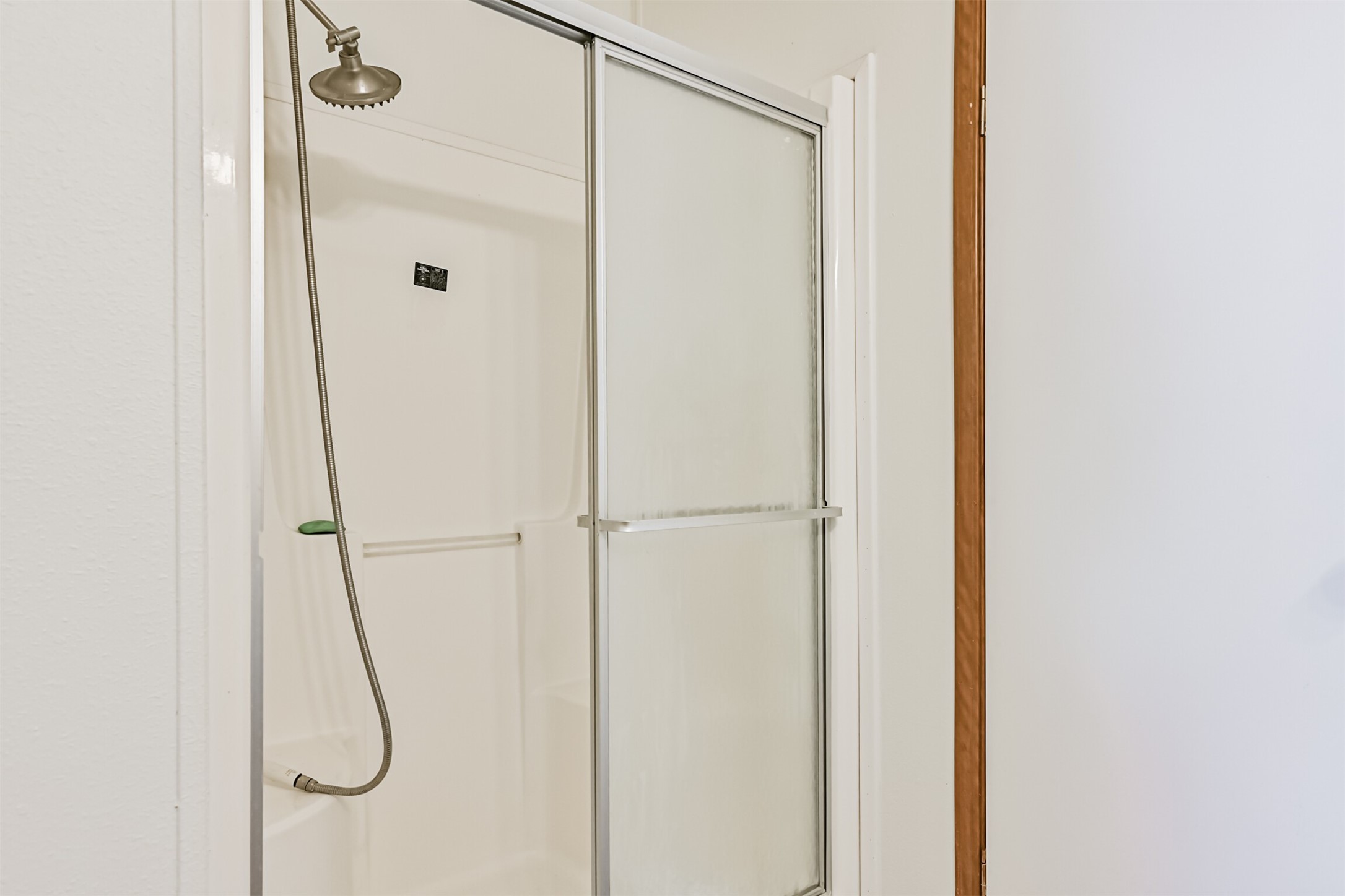 14515 Farm To Market Road 523 Angleton, TX 77515 - Photo 19 of 25 a bathroom with a glass shower door