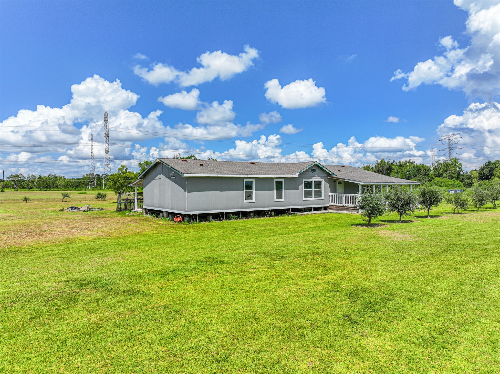 14515 Farm To Market Road 523 Angleton, TX 77515 - Photo 8 of 25 a front view of a house with a garden