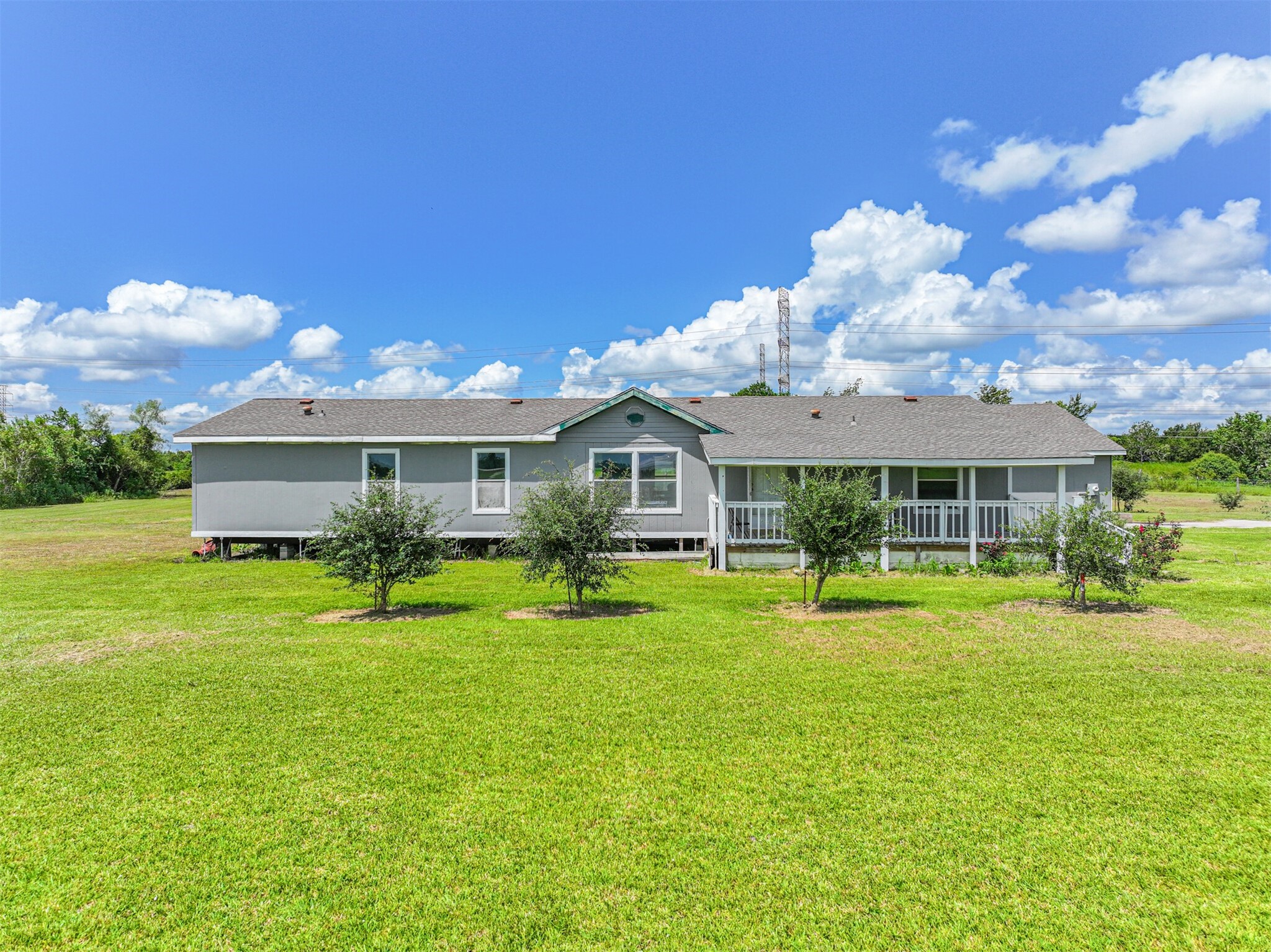 14515 Farm To Market Road 523 Angleton, TX 77515 - Photo 9 of 25 a front view of a house with garden