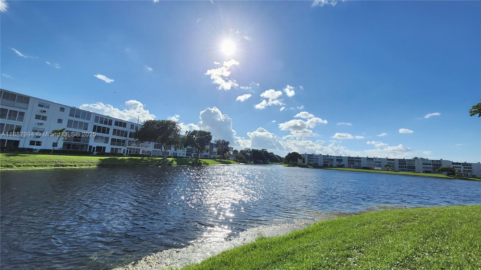2079 Harwood F, Unit 2079 Deerfield Beach, FL 33442 - Photo 2 of 33 a view of a lake in middle of a house