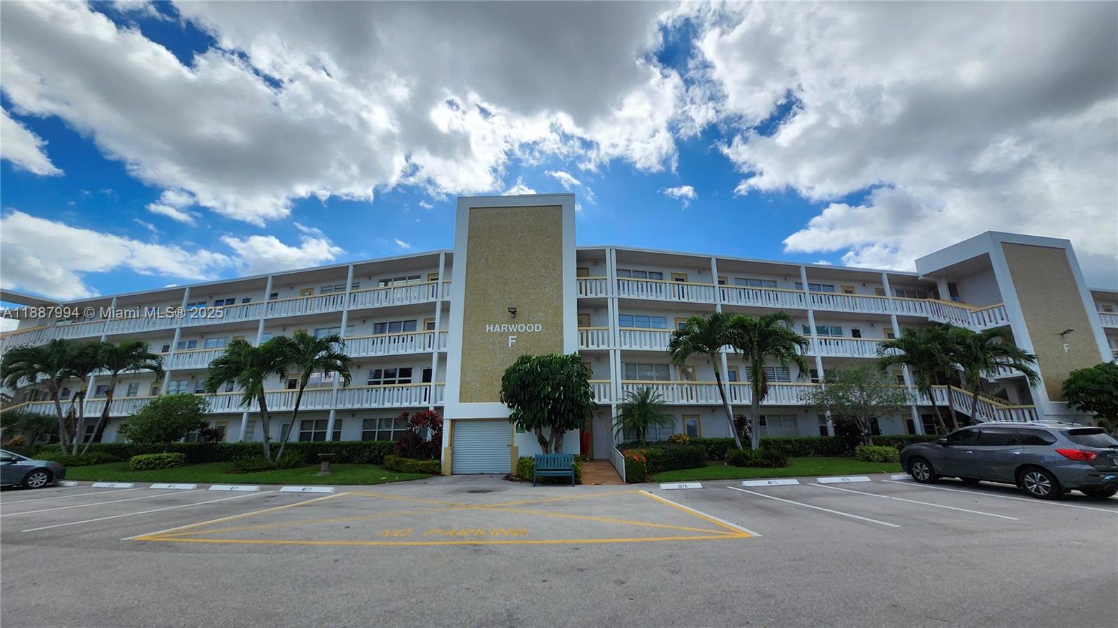 2079 Harwood F, Unit 2079 Deerfield Beach, FL 33442 - Photo 3 of 33 a car parked in front of a building