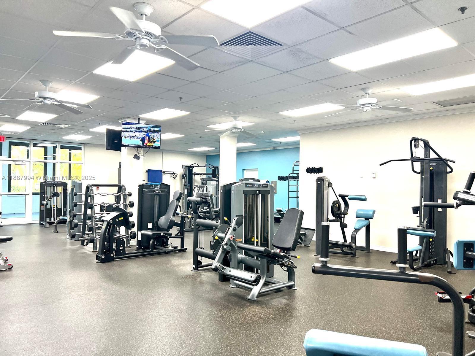 2079 Harwood F, Unit 2079 Deerfield Beach, FL 33442 - Photo 32 of 33 a view of a room with gym equipment