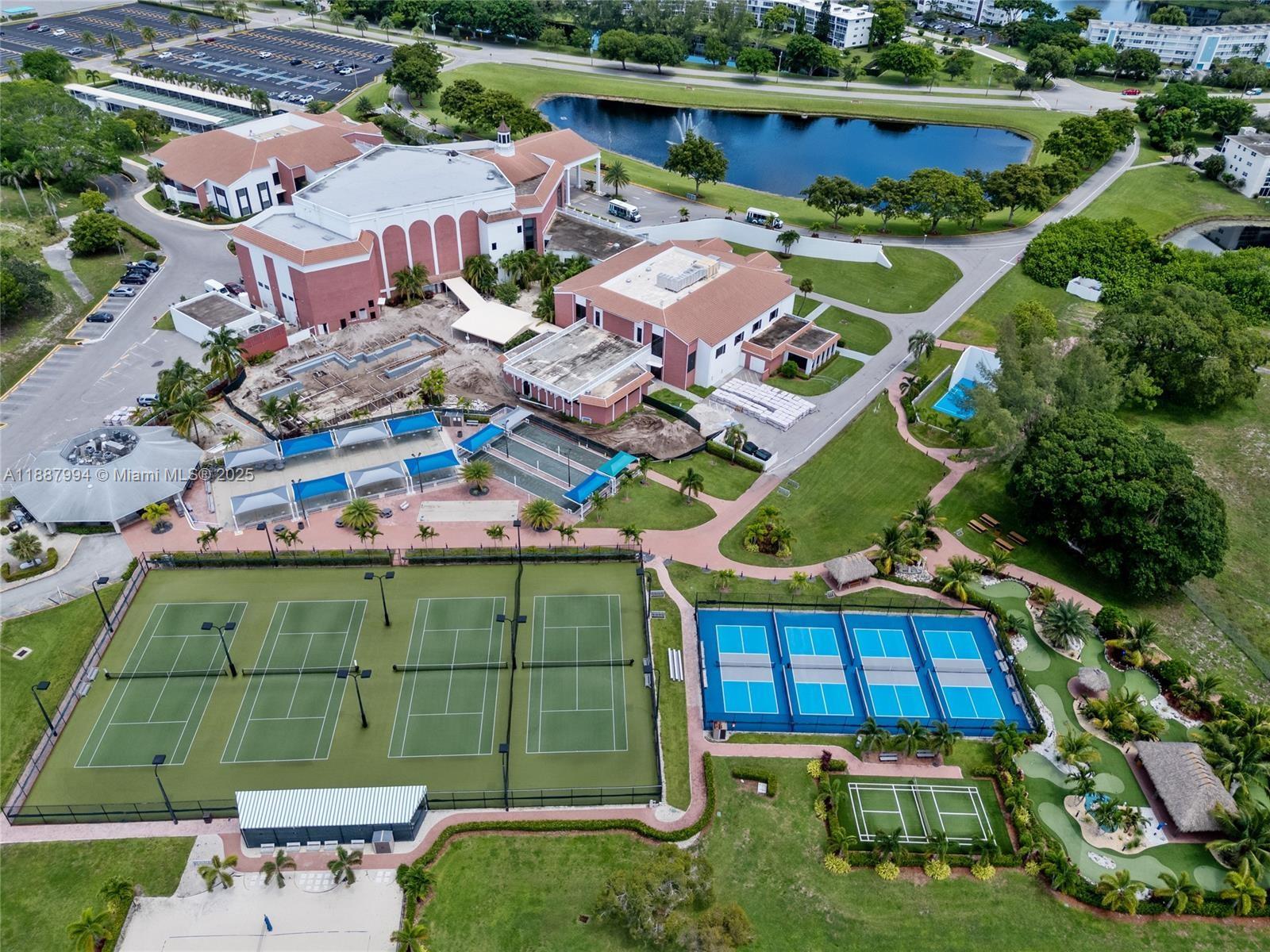 2079 Harwood F, Unit 2079 Deerfield Beach, FL 33442 - Photo 33 of 33 an aerial view of a house with a garden and lake view