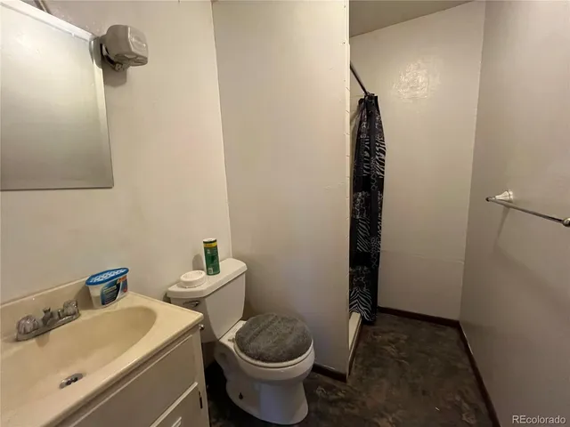 a bathroom with a sink and toilet