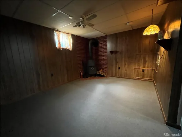 an empty room with windows and entrance