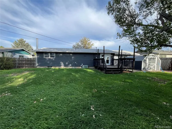front view of a house with a yard porch and sitting area