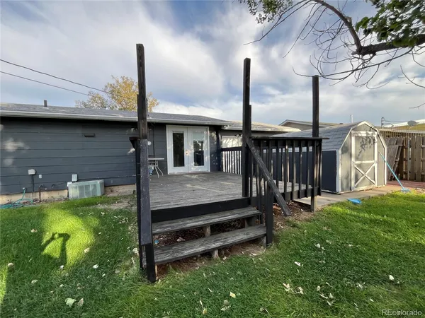 a view of a deck with a big yard