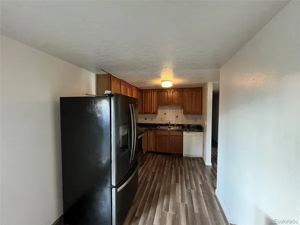 a kitchen with stainless steel appliances a refrigerator and a sink