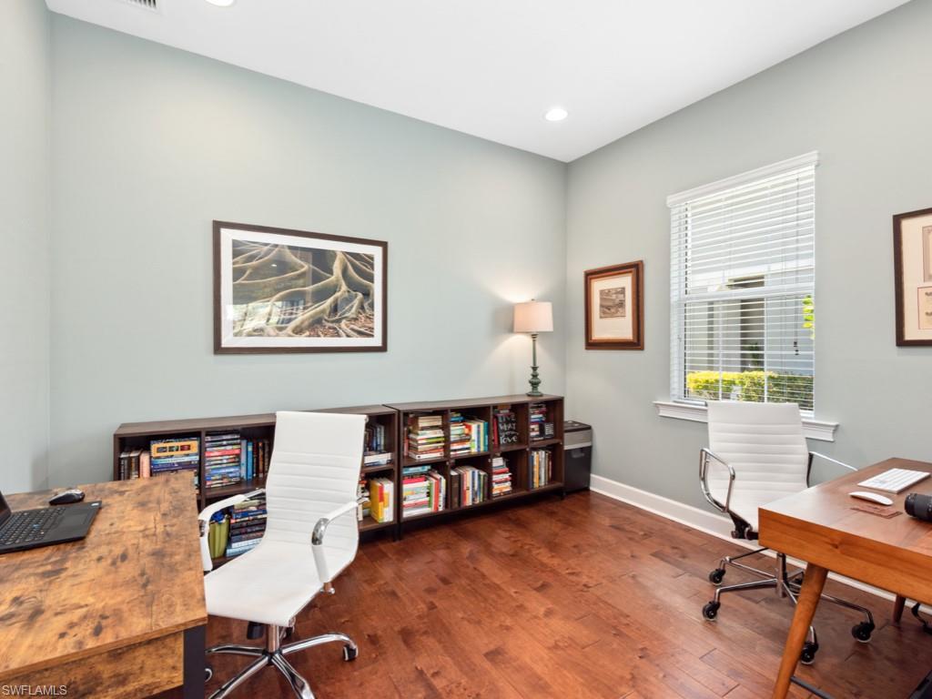 5697 Highbourne Drive Naples, FL 34113 - Photo 13 of 35 a workspace with furniture hardwood and a window