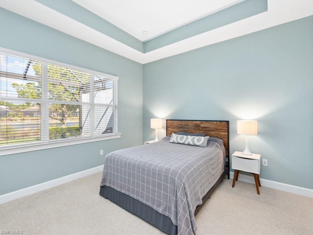 5697 Highbourne Drive Naples, FL 34113 - Photo 14 of 35 a bedroom with a bed and a window
