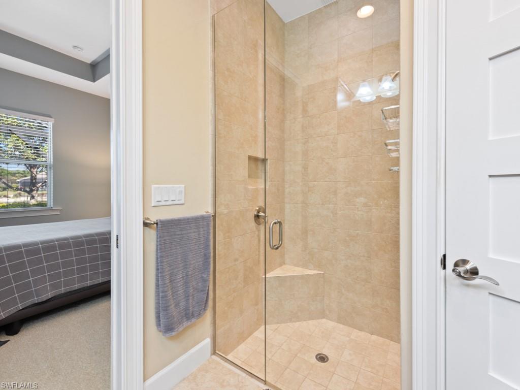 5697 Highbourne Drive Naples, FL 34113 - Photo 15 of 35 a bathroom with a shower
