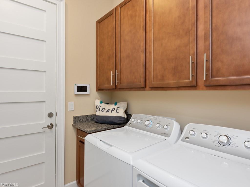 5697 Highbourne Drive Naples, FL 34113 - Photo 19 of 35 a utility room with dryer and washer