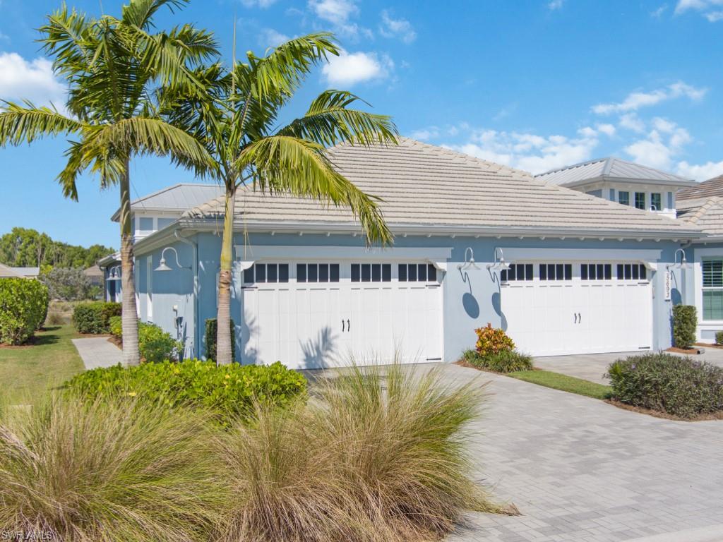 5697 Highbourne Drive Naples, FL 34113 - Photo 2 of 35 a view of swimming pool with palm trees