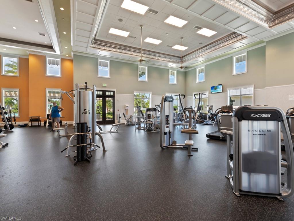 5697 Highbourne Drive Naples, FL 34113 - Photo 22 of 35 a gym room with gym equipment