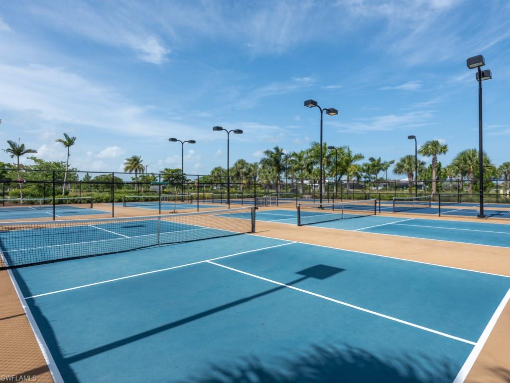 5697 Highbourne Drive Naples, FL 34113 - Photo 23 of 35 a view of a tennis court
