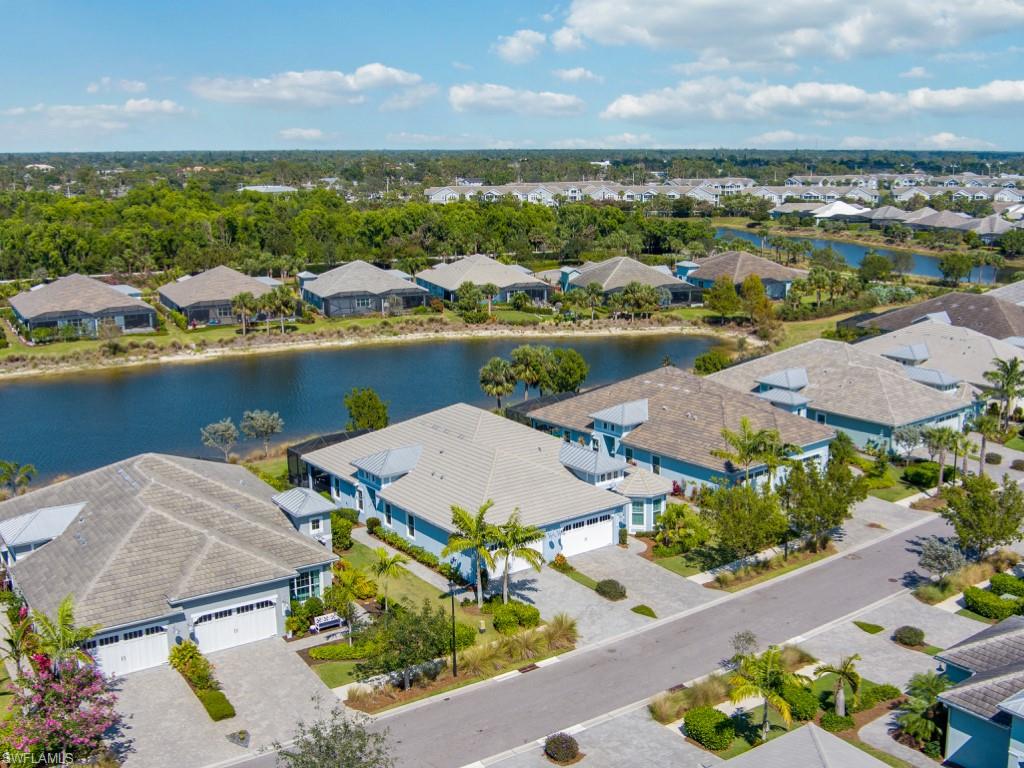 5697 Highbourne Drive Naples, FL 34113 - Photo 27 of 35 an aerial view of a house with a lake view
