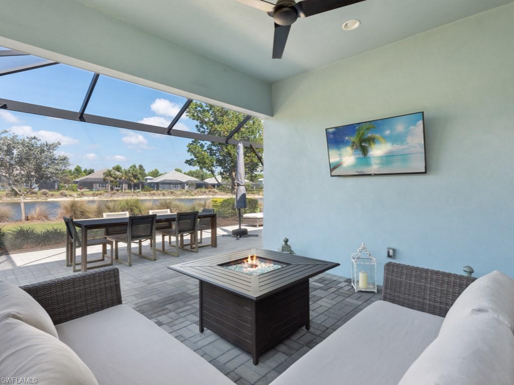 5697 Highbourne Drive Naples, FL 34113 - Photo 3 of 35 a living room with furniture and a large window