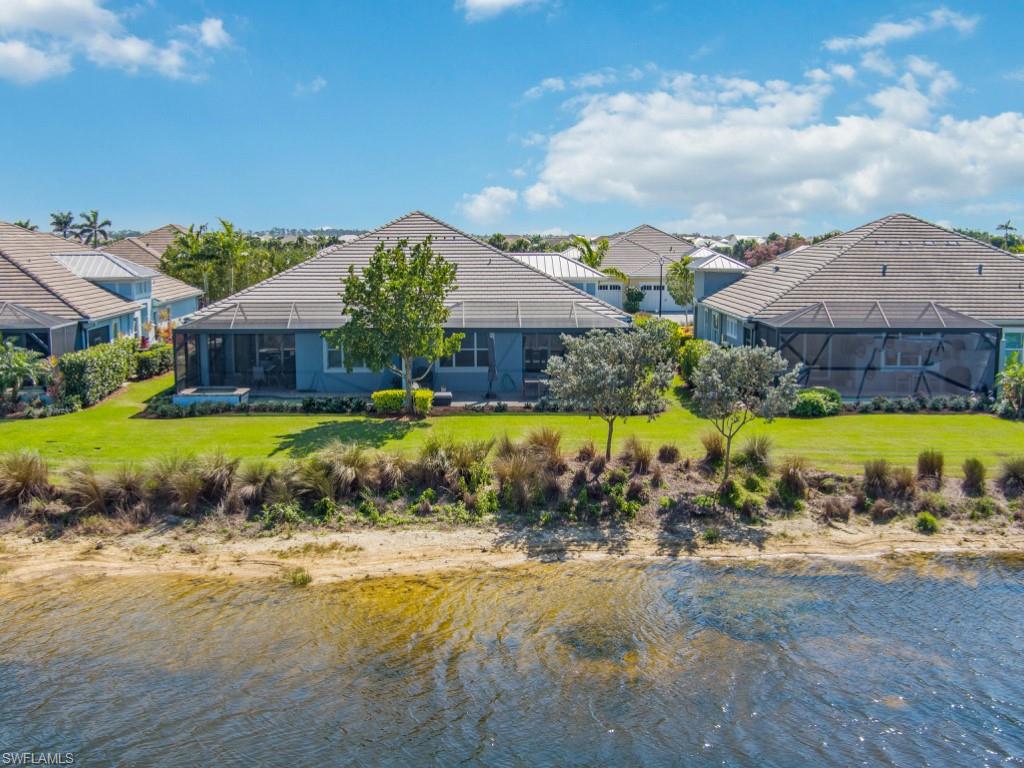 5697 Highbourne Drive Naples, FL 34113 - Photo 31 of 35 a view of a house with a yard